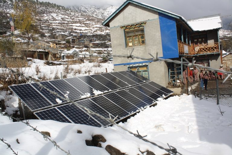 Solar pannel from west part and in background snow with HEH